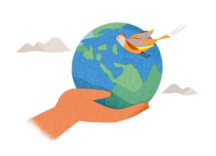 A bird flies around a hand holding a globe