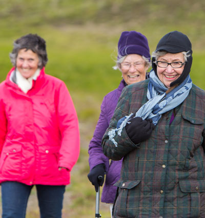 three women walking in iceland