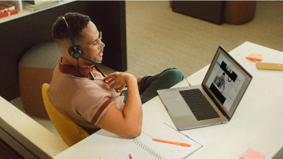 Man at desk using zoom meetings