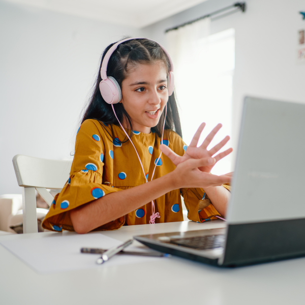 Girl applauding in front of laptop