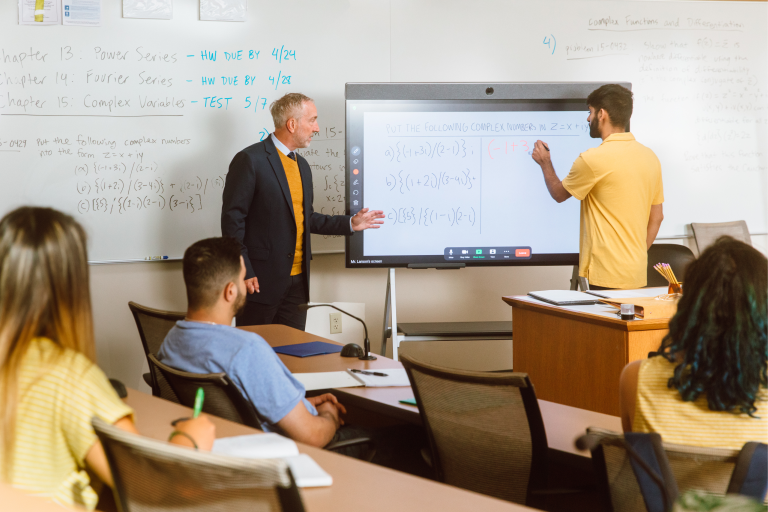 Teachers at whiteboard